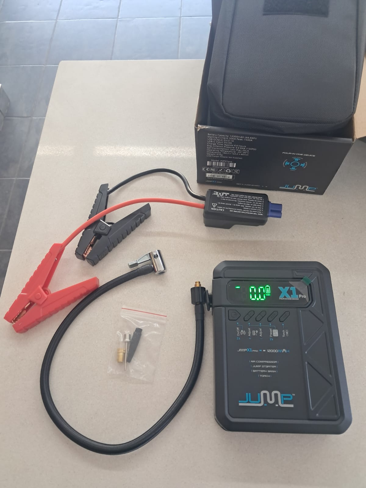 JUMP X1 Pro unboxed: jump starter, air compressor hose, jumper cable and carry bag